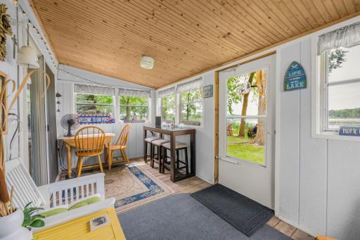 The porch you'll never want to leave. Start your mornings with coffee overlooking the lake and end your evenings watching spectacular Minnesota sunsets. This bright three-season porch extends your living space while bringing the outdoors in.