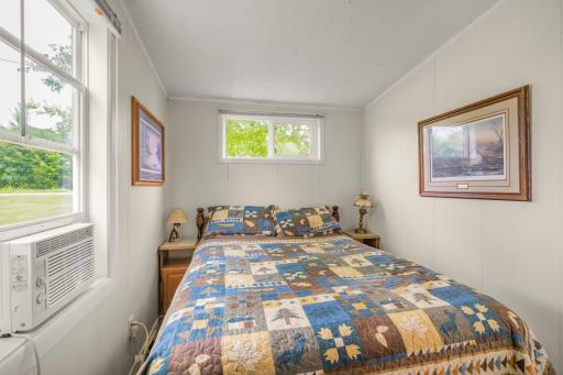 Drift off after a day on the lake. This inviting bedroom offers a peaceful place to recharge after boating, fishing, swimming, or watching the sunset. Sold fully furnished, it's ready for your first weekend away.