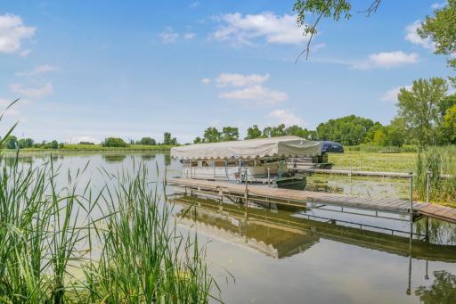 Your lake adventure starts here. The included pontoon, lift, trailer, and private dock mean you can launch into lake life from day one. Just bring your suitcase and enjoy the rest of the summer!