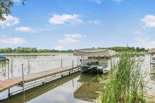 An incredible value! The sale includes the pontoon, lift, trailer, and custom cover, giving you a true turnkey lake property that's ready to enjoy the day you close.
