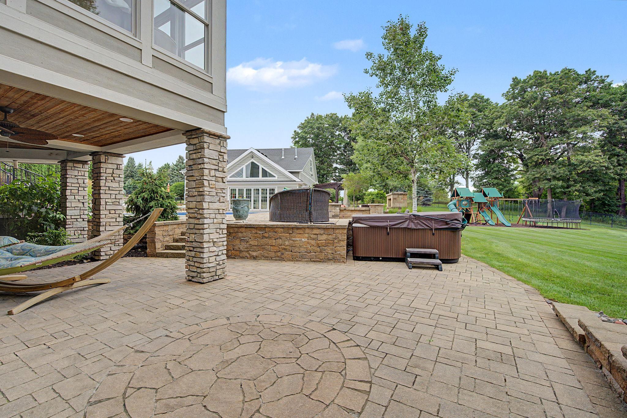 Lower Patio Area with Hot Tub | 15471 Dogwood St NW
