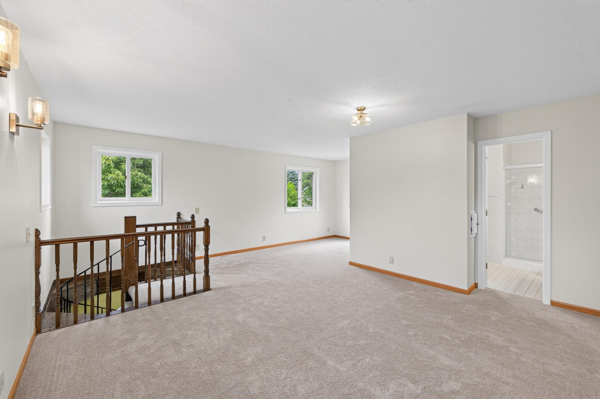 Primary Bedroom toward bath and exit to the deck