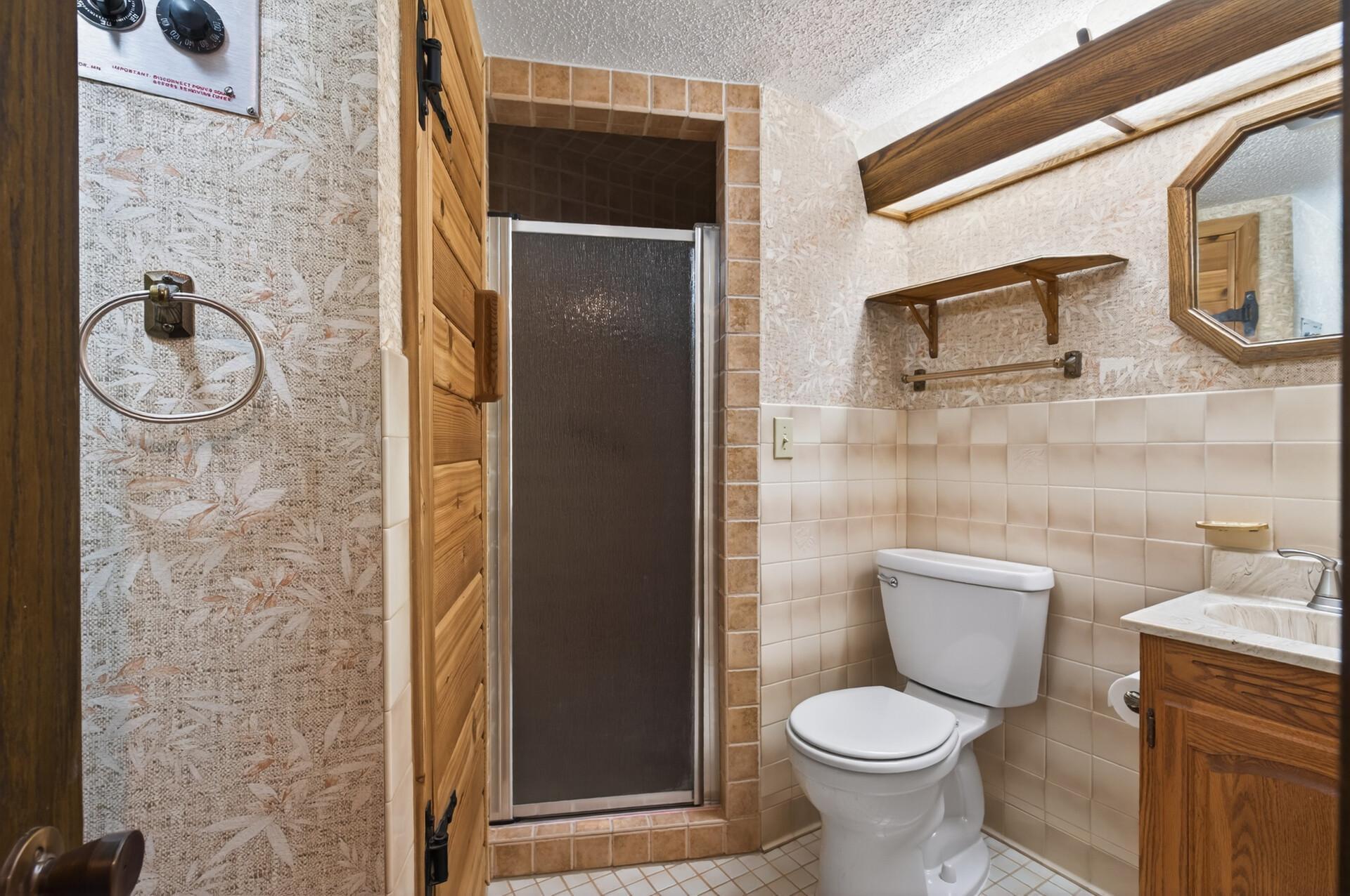 3/4 lower level bath with sauna to the left