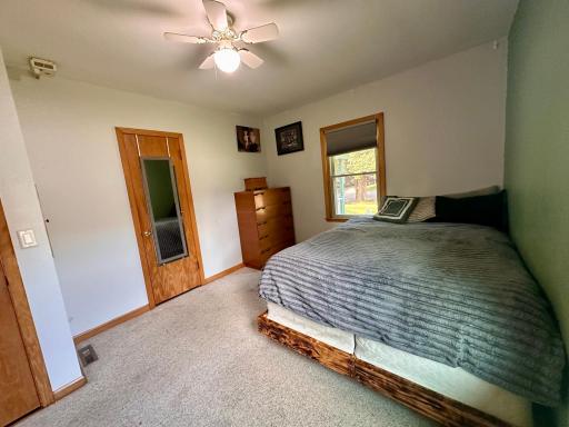 Bedroom #2 features carpeted floor & ceiling fan.