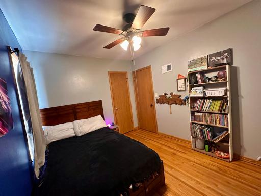 Bedroom #1 - space for a double or queen bed AND a dresser, chest of drawers or shelving.