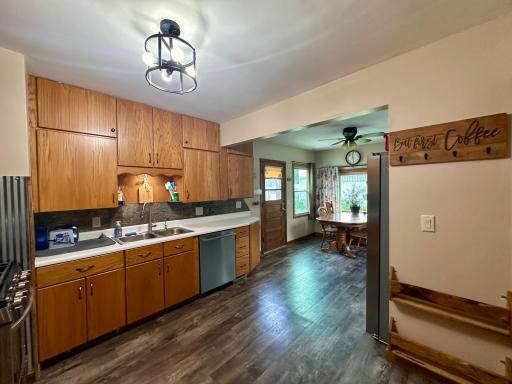 Pass through the main level living room to access the kitchen and dining area.