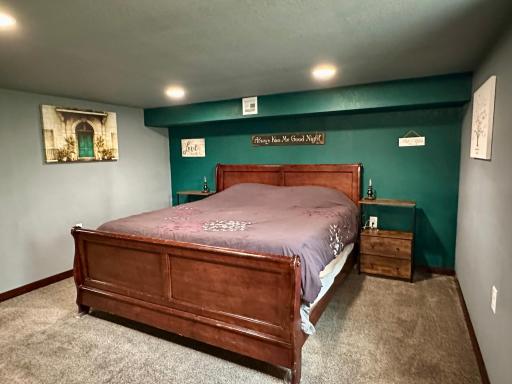A king size bed plus full size side tables on both sides of bed in the primary BR.