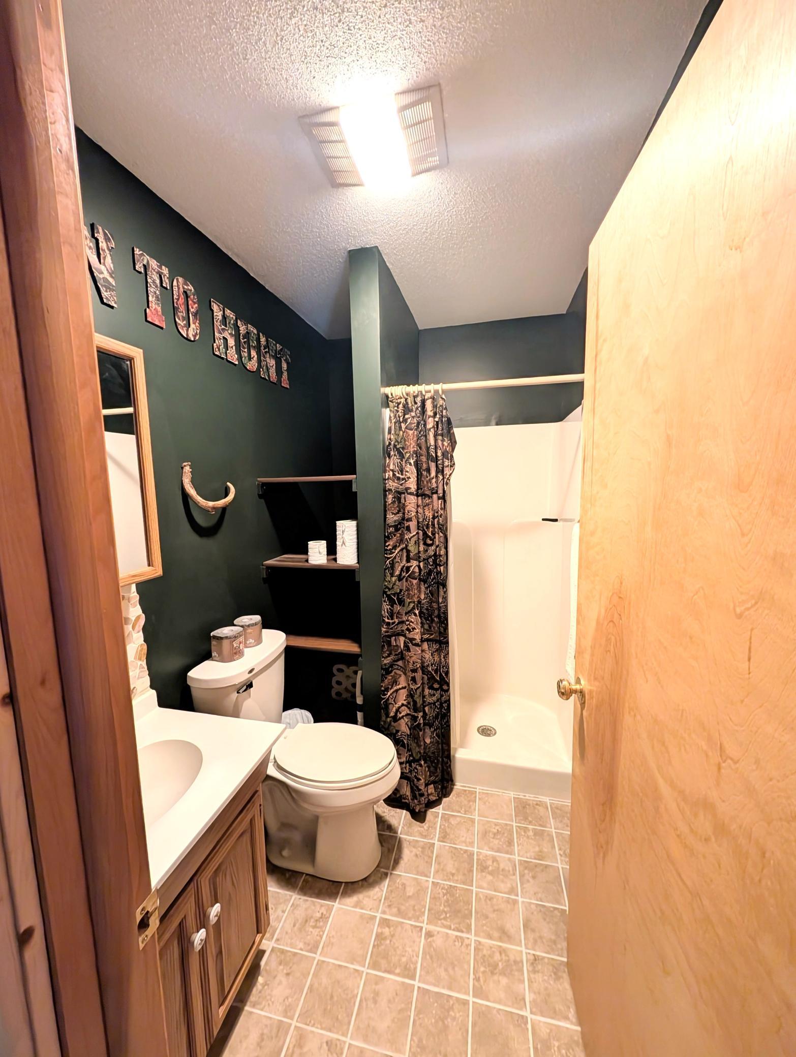 upstairs bathroom.between two spaces