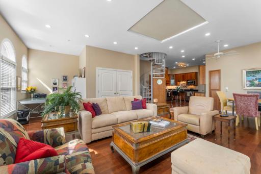 Living room open to office nook and kitchen
