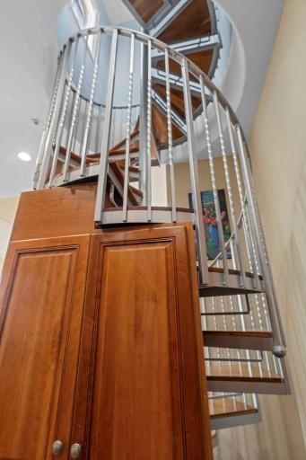 Private spiral staircase to rooftop deck