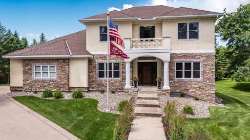 Amazing home situated on a beautifully landscaped corner lot with striking stucco and stone accents.