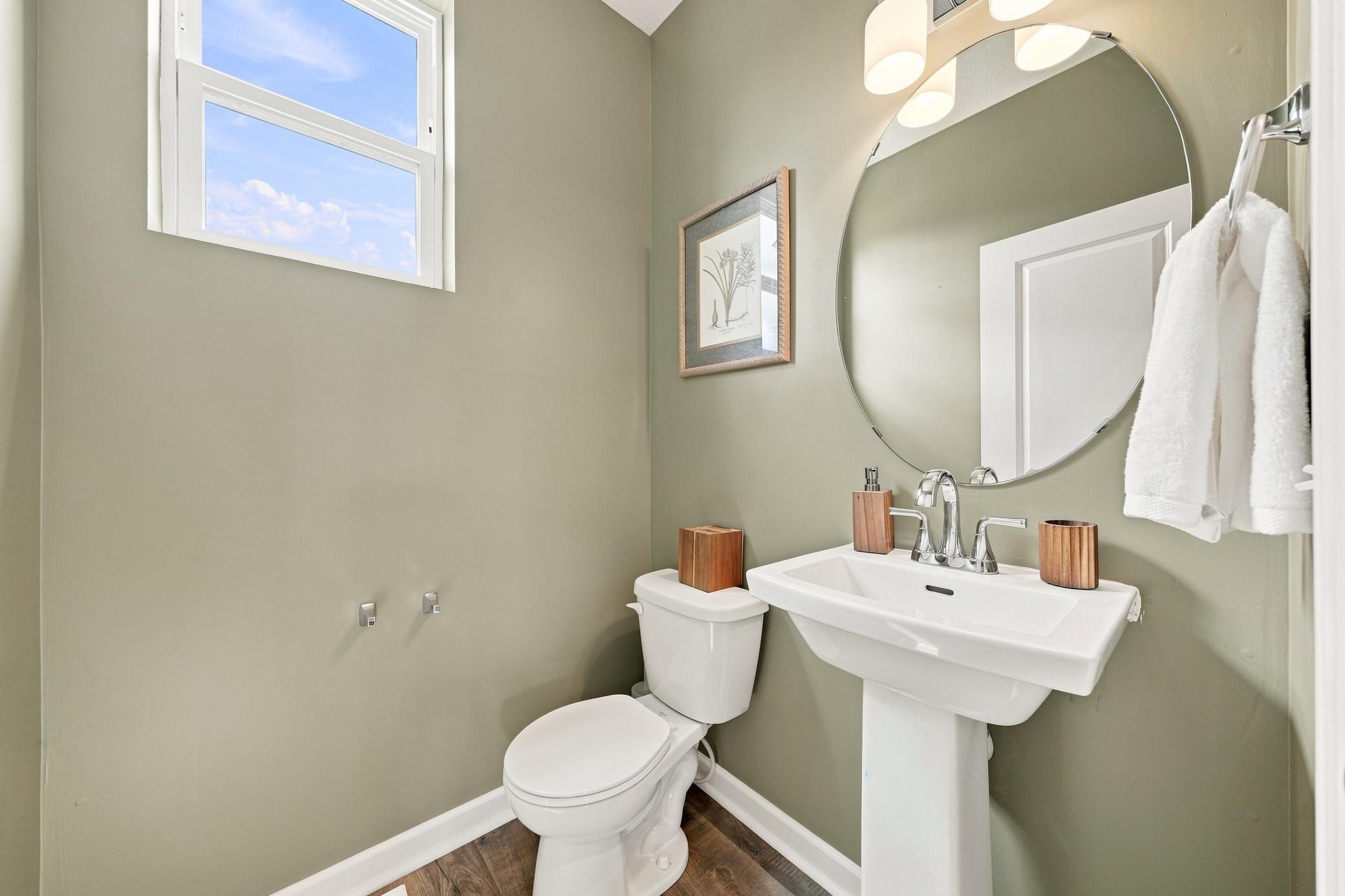 Half bath is conveniently located on the main level. New flooring installed.