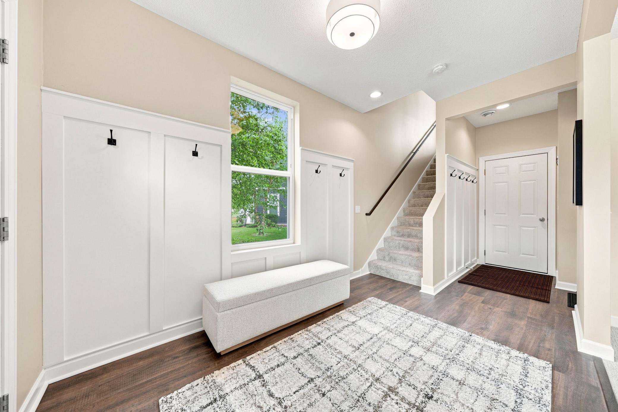 Hang your hat, coat, school bags here! To your right is a large flex room perfect for a family room, playroom or gym!