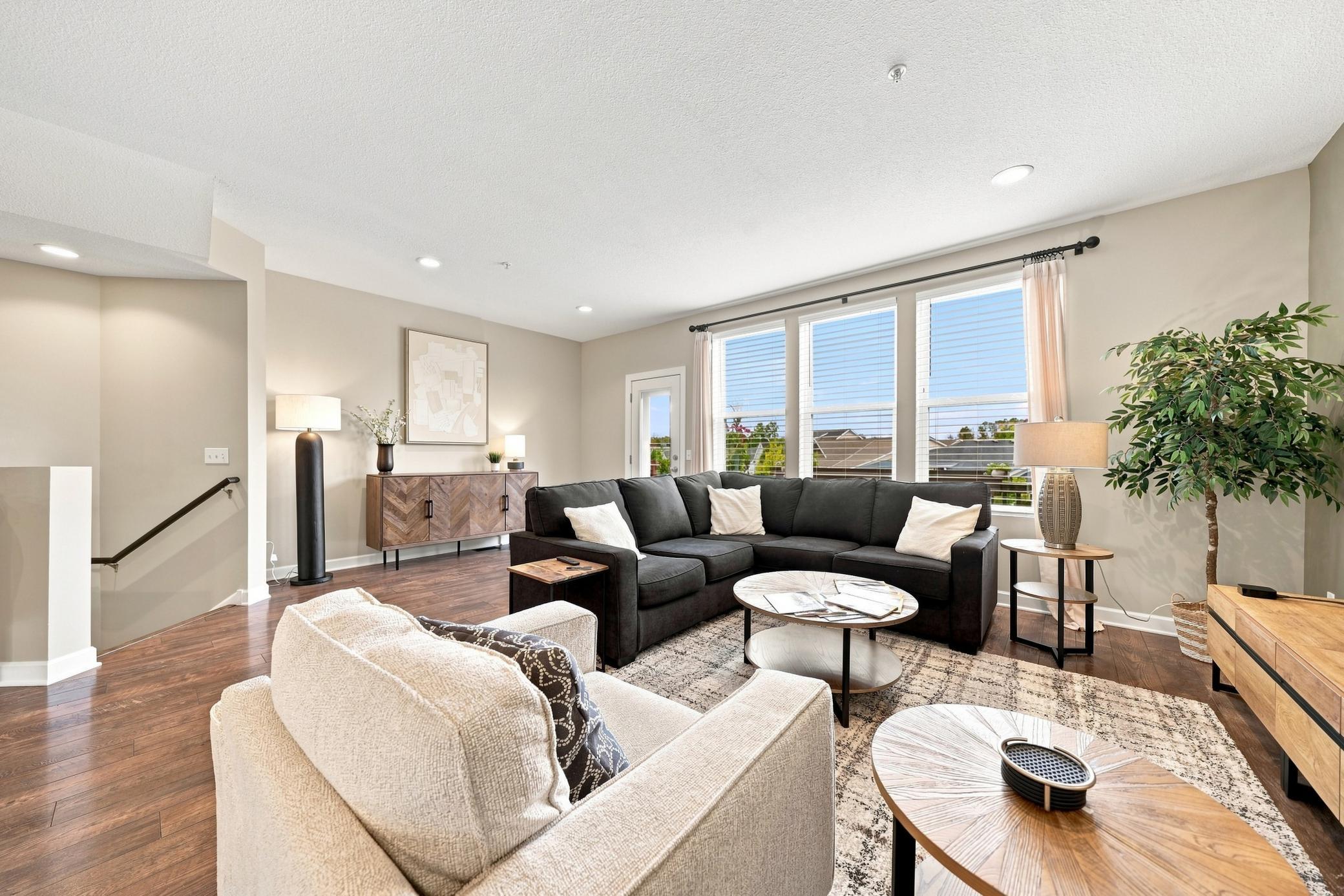 This spacious living room fills with natural light