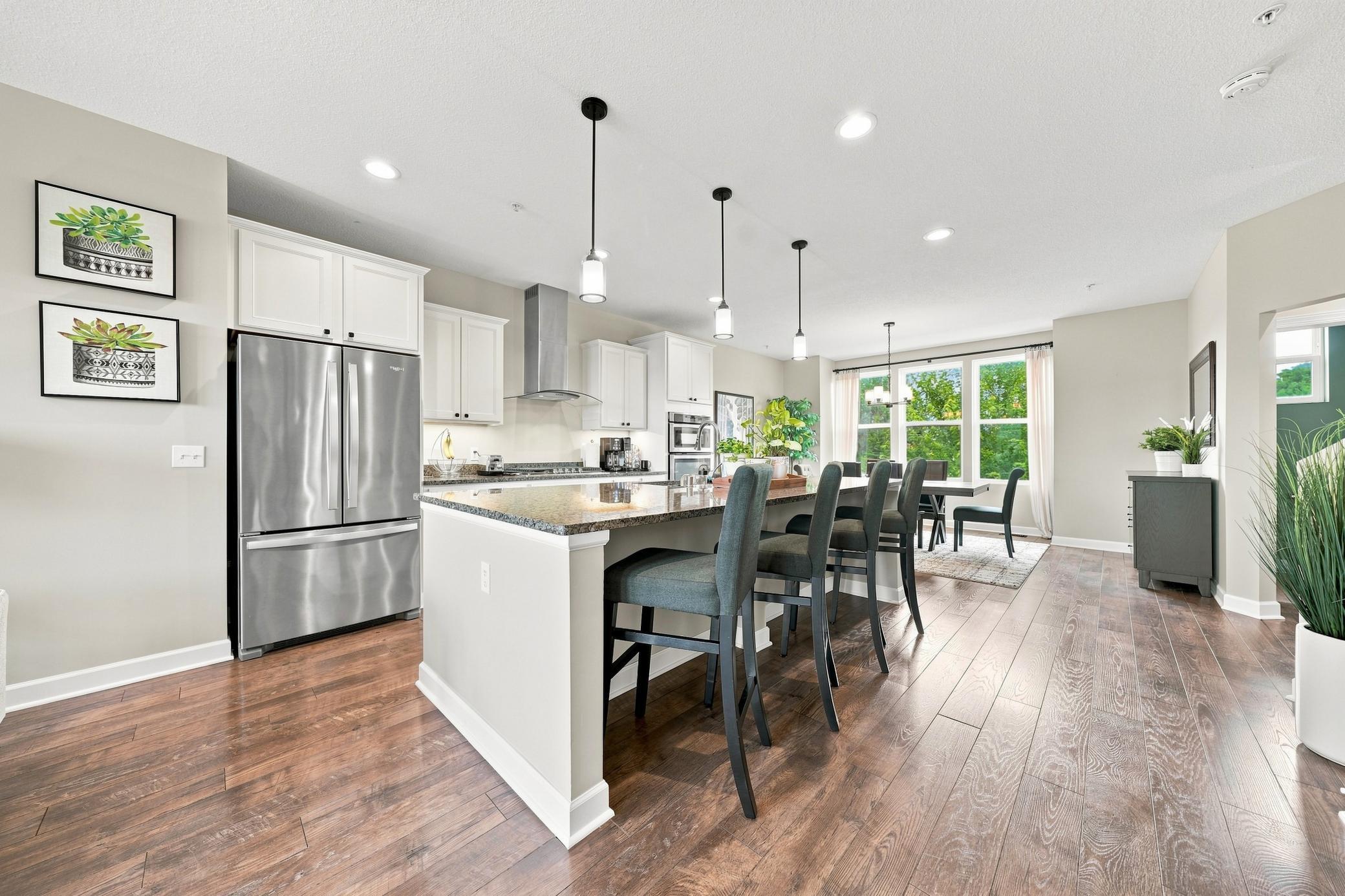 The large kitchen island, breakfast area and living room are perfect for entertaining