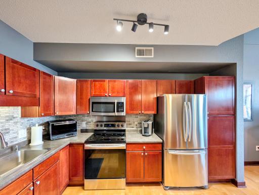 Updated kitchen adds a pop of color to the main space.