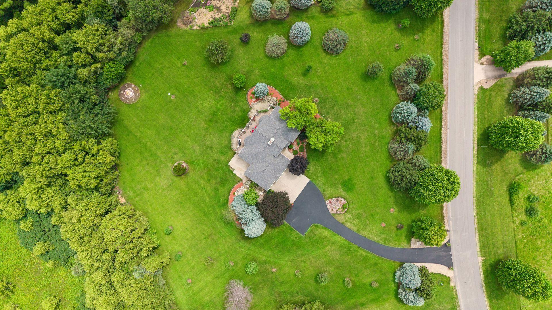 Surrounded by beautifully landscaped grounds, this 6.6-acre property offers space, privacy, and endless possibilities.