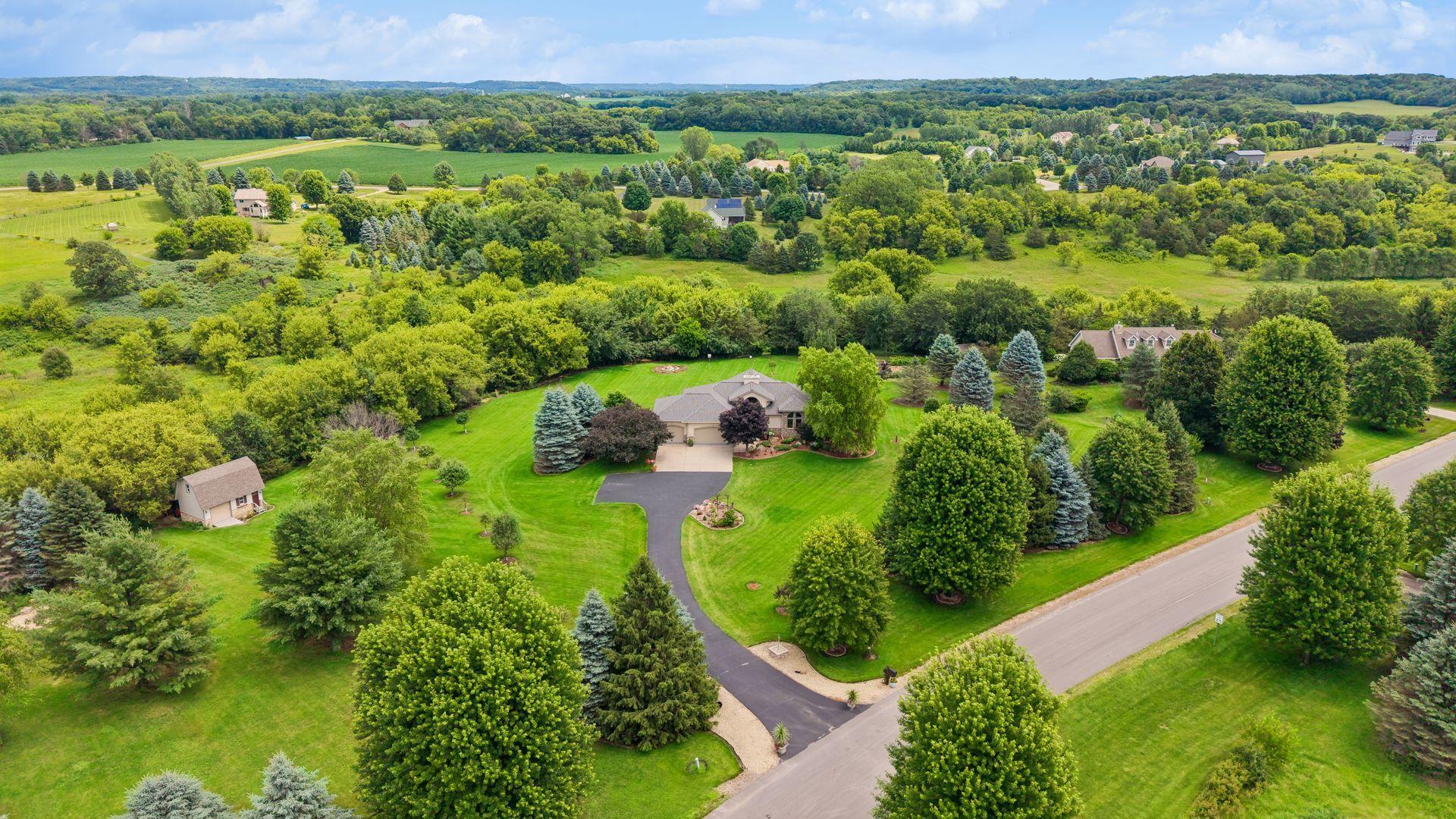 Welcome home to the Wisconsin countryside! Located on 6.6 acres near River Falls, this exceptional property blends spacious living, thoughtful amenities, and beautiful outdoor spaces for the perfect country lifestyle.