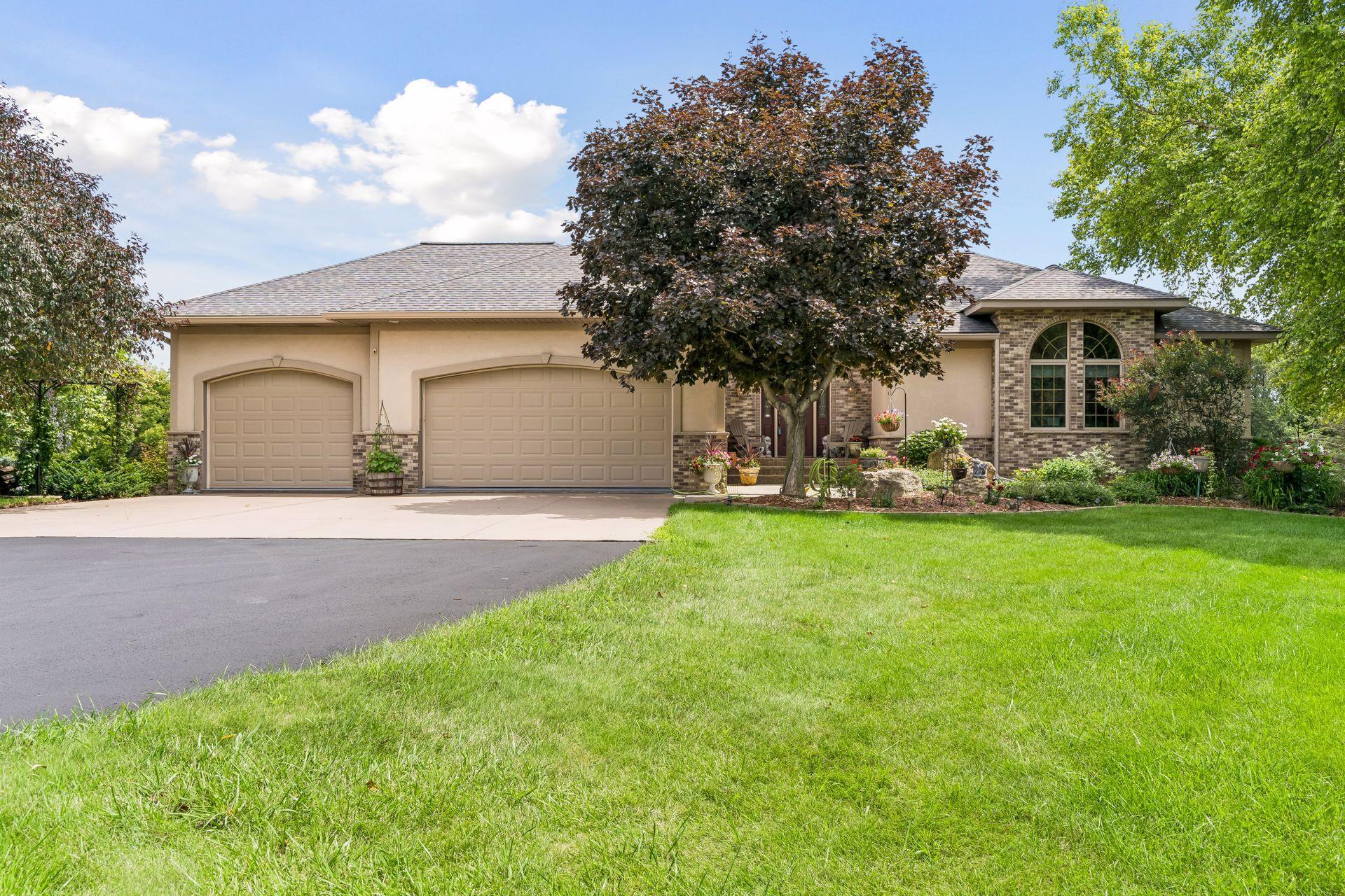 3 car garage (additional 3 car below). Large concrete appron and freshly seal coated asphalt (2026)