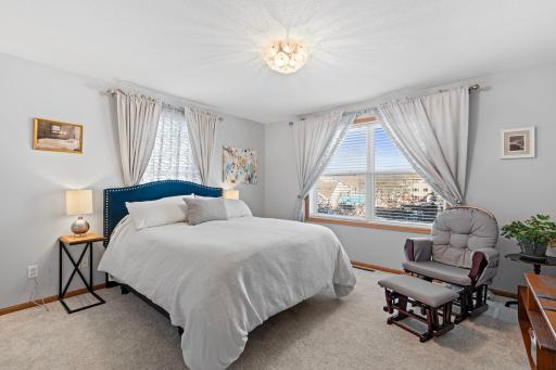 Upper level primary bedroom with spacious walk in closet. New upper level carpet.