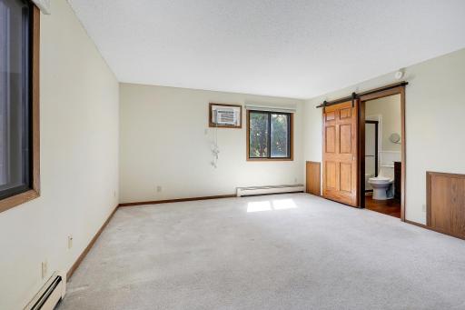 Large primary bedroom and en suite bathroom.