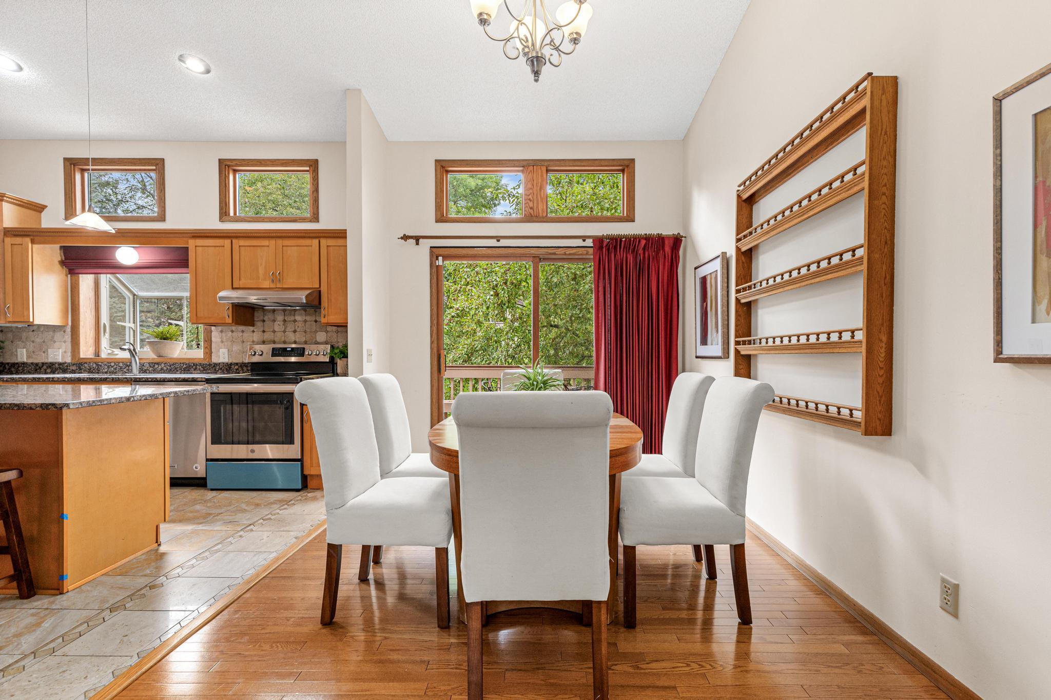 Hardwood flooring flows from the dining room space the living room