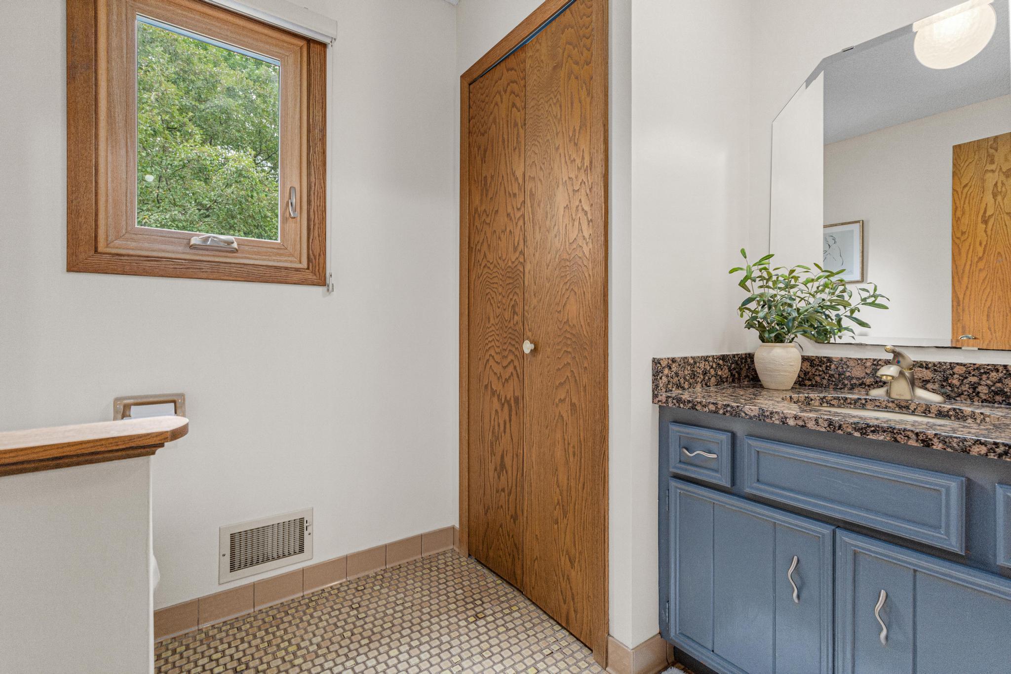 Main floor 1/2 bath with updated granite countertops