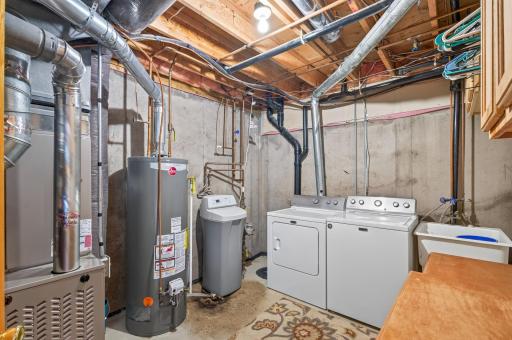 Utility room on lower level with new furnace and water heater. Also a new air conditioner.