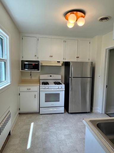 6-Kitchen with new flooring and paint plus some new appliances.jpeg