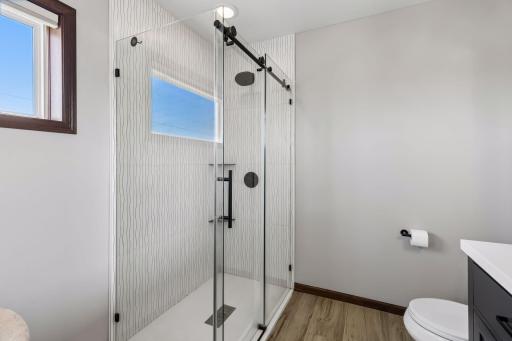 All glass/tile shower at primary bath