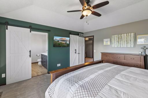 Primary suite with private 3/4 bath and large walk-in closet