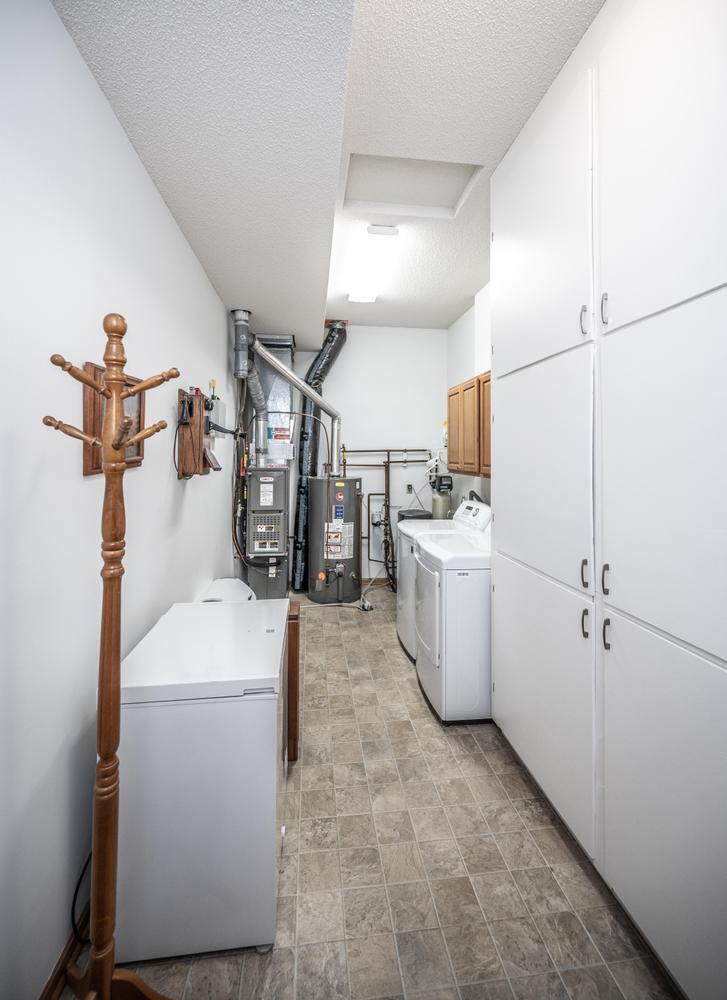 The laundry/utility room is large and has tons of storage!