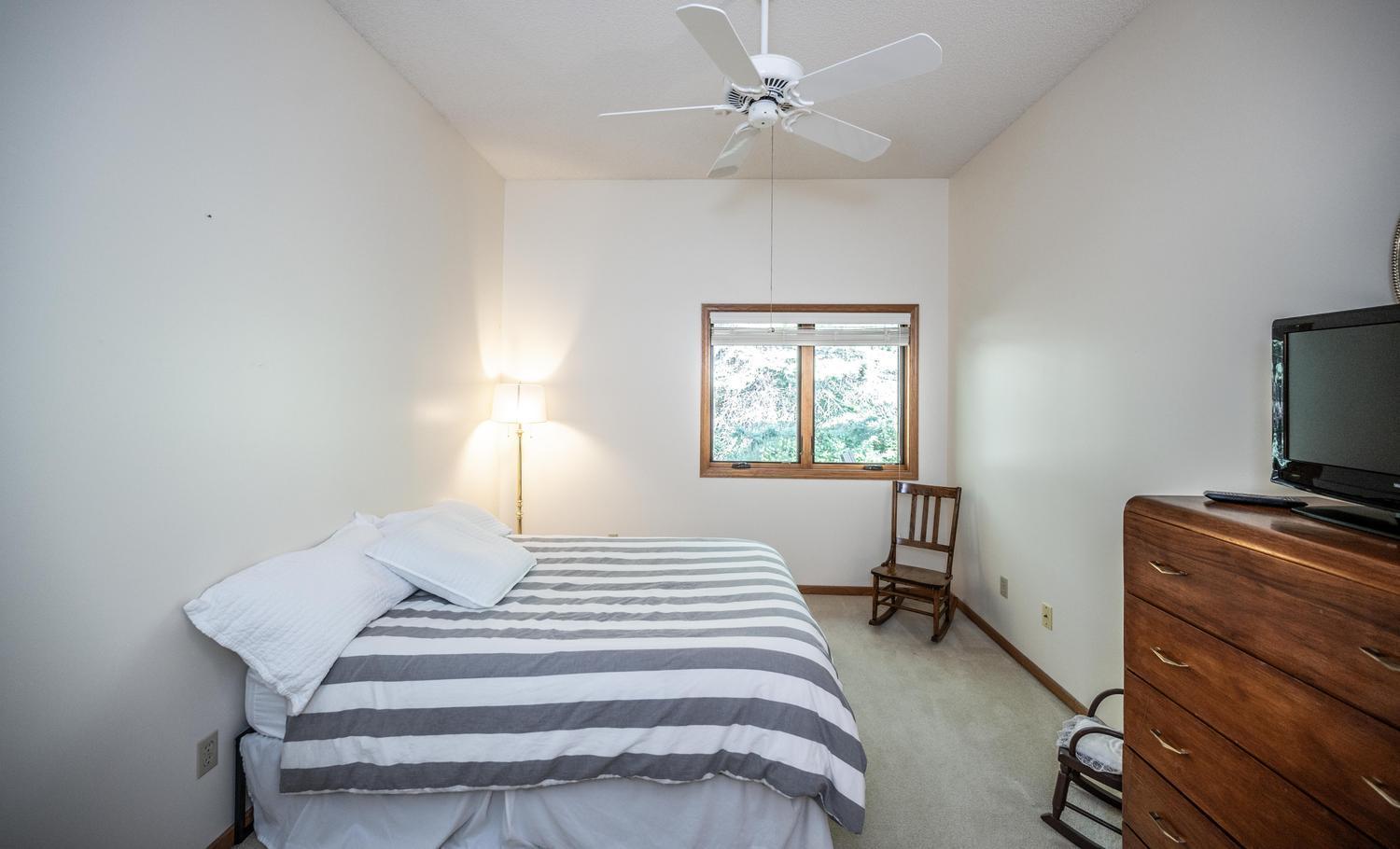 The primary bedroom is large and the tall ceilings make it feel even larger!