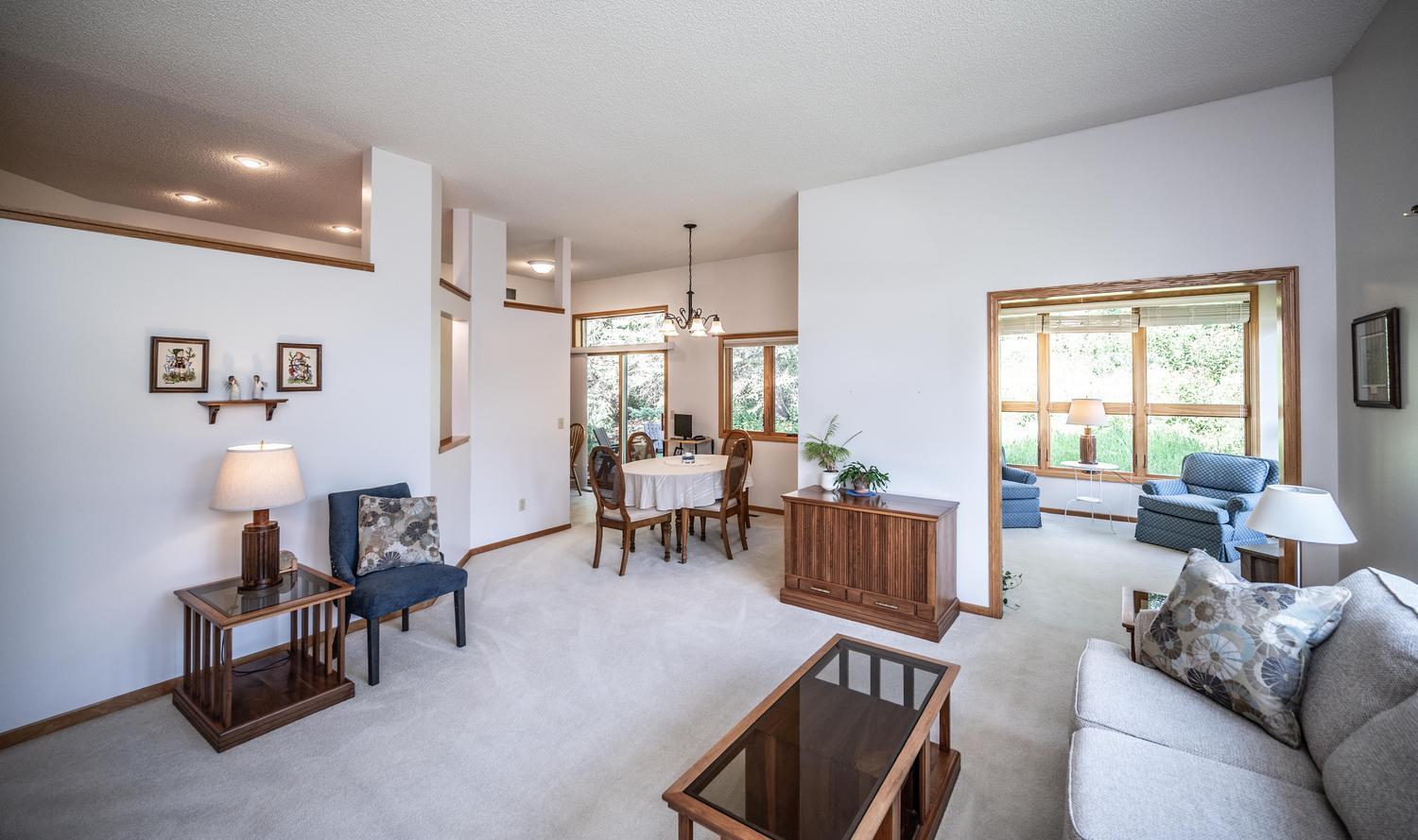 The living room leads into the dining room area