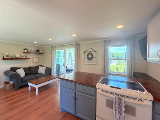 Blending modern updates with cozy cabin charm, the bright and airy main living area flows effortlessly into the lakeside sunroom, creating the perfect place to unwind after a day on the water.