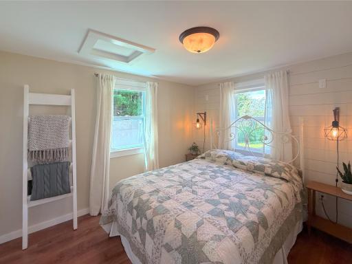 Wake up to peaceful lake living in this beautifully remodeled bedroom, offering a warm, inviting atmosphere and a relaxing place to recharge after a day on the water.