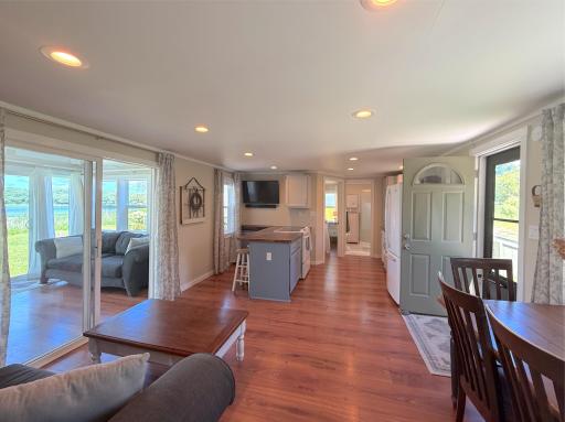 Whether preparing meals or relaxing with family, you'll enjoy an open floor plan that keeps everyone connected while showcasing beautiful views of Moose Lake just beyond the windows.