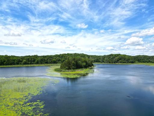 Take in picturesque views of the charming island directly across from your dock, creating a scenic backdrop for every day on Moose Lake.