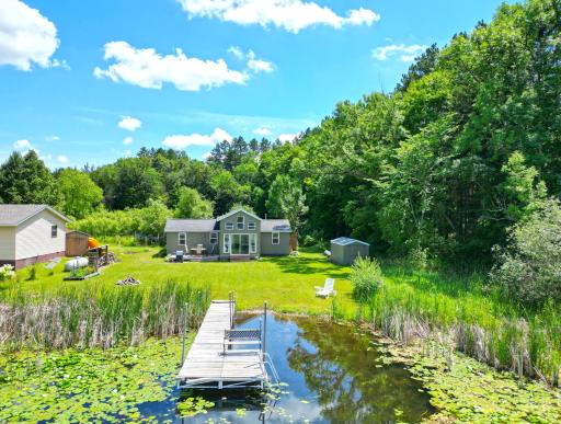 Complete with two storage sheds for all your lake toys and outdoor gear and outdoor rinsing area, this turnkey retreat is ready to enjoy from day one.