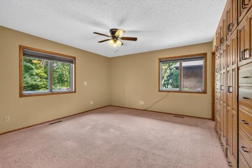Bedroom 2 w/ custom cabinet wall for storage