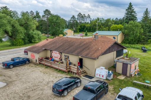 Welcome to The Big Winnie Bar and Cafe located in Bena, Minnesota Just off of Highway 2. Parking lot, Side Deck and storage shed.