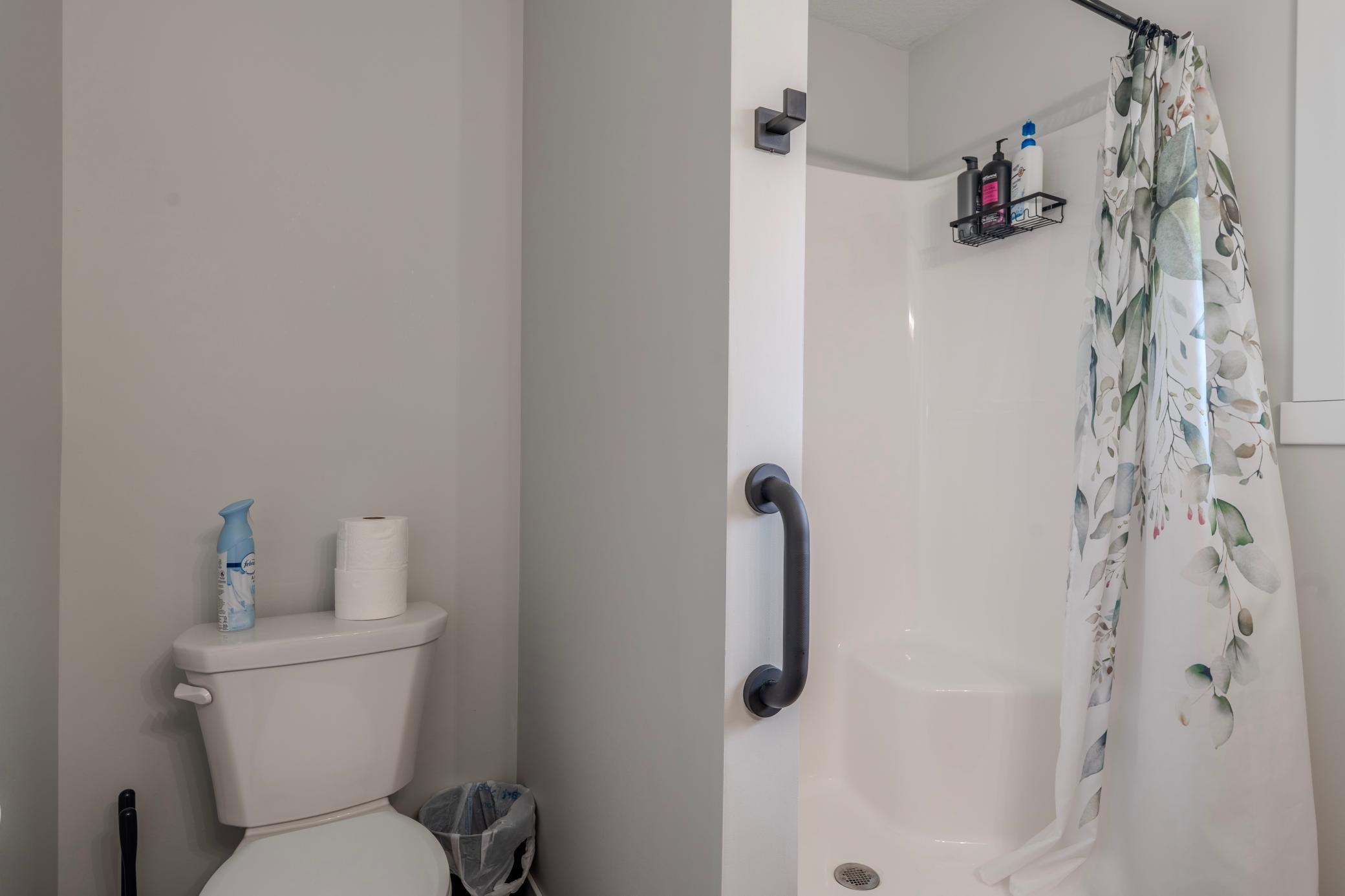 Bathroom with shower off laundry room