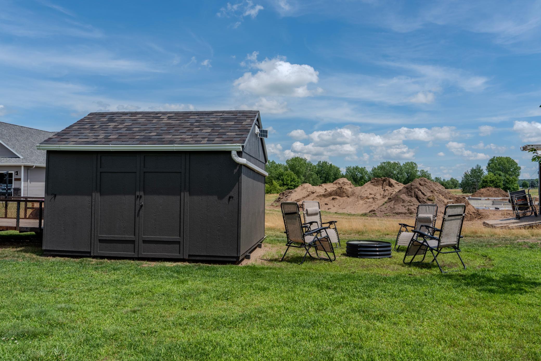 Storage shed and firepit