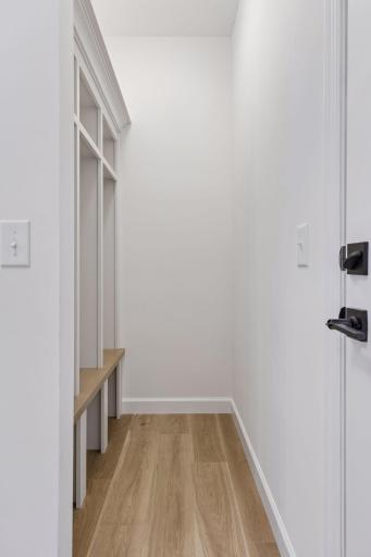 Drop-off zone near garage entry to hang coats, backpacks and shoes or boots