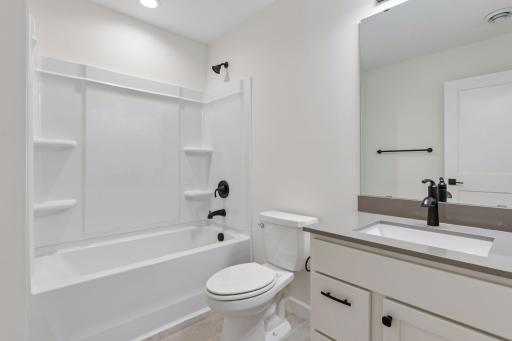 Lower level full bath with quartz counter
