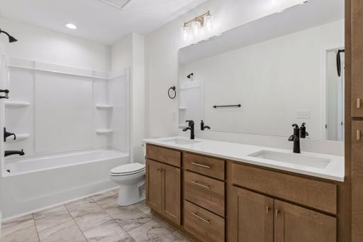 Upper level full bath with double sinks and quartz counters