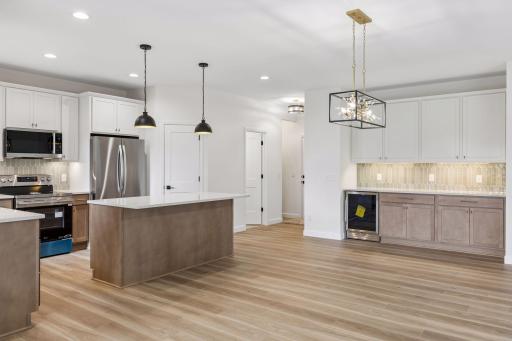 Chandelier for dining room table with easy access to island and kitchen