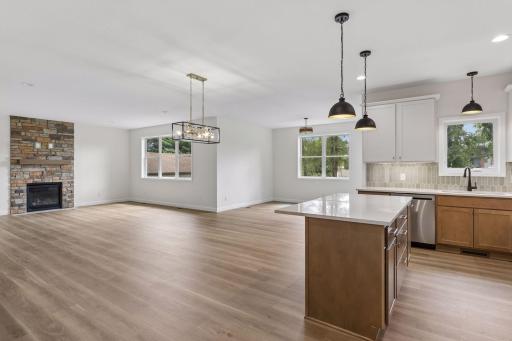 View of living room, sunroom and large island