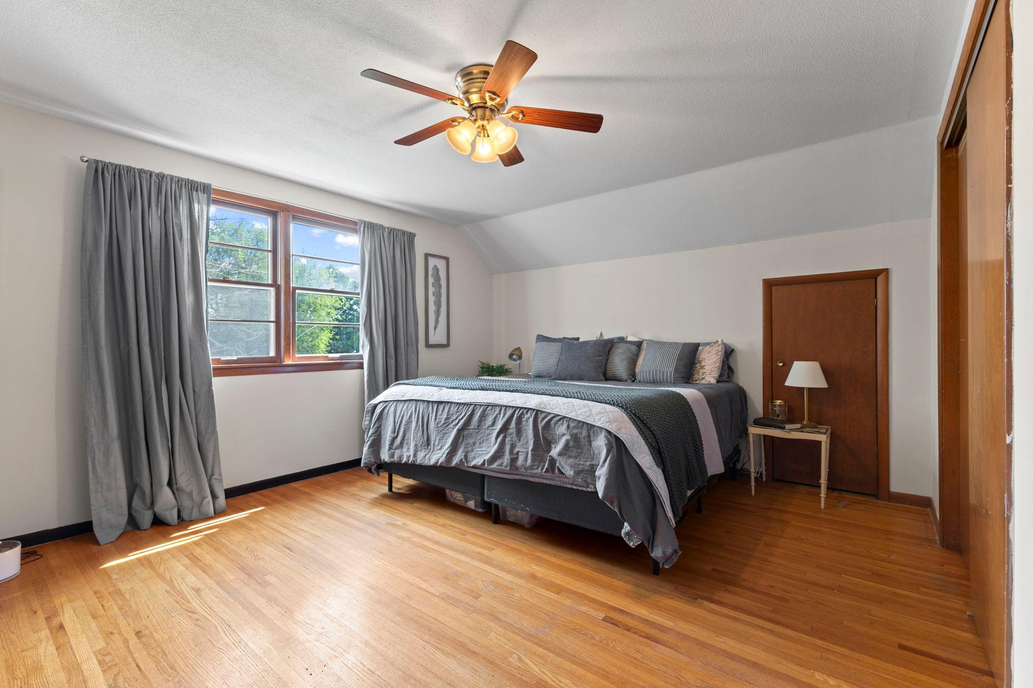 Another bright, generous sized bedroom with gleaming hardwood floors.