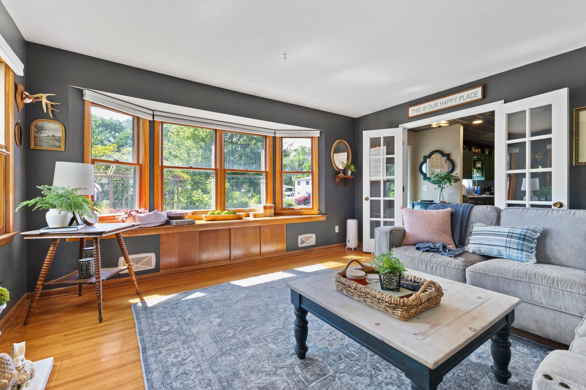 The living room offers a warm and welcoming place to relax by the fireplace.